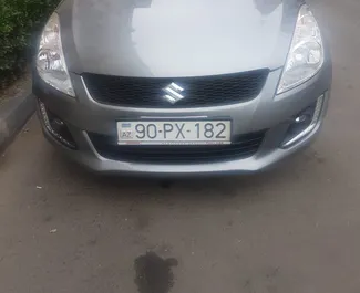 Vooraanzicht van een huurauto Suzuki Swift in Bakoe, Azerbeidzjan ✓ Auto #13498. ✓ Transmissie Automatisch TM ✓ 0 beoordelingen.