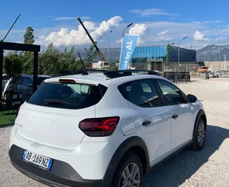 Dacia Sandero Stepway 2024 beschikbaar voor verhuur op de luchthaven van Tirana, met een kilometerlimiet van onbeperkt.