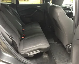 Vooraanzicht van een huurauto Ford Kuga in Minsk, Wit-Rusland ✓ Auto #13998. ✓ Transmissie Automatisch TM ✓ 0 beoordelingen.