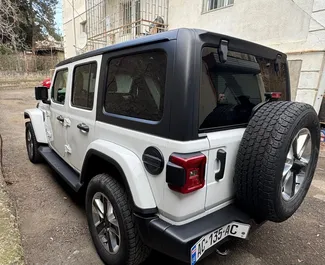 Autohuur Jeep Wrangler Sahara 2021 in in Georgië, met Benzine brandstof en 270 pk ➤ Vanaf 239 GEL per dag.
