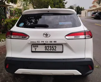 Vooraanzicht van een huurauto Toyota Corolla Cross in Dubai, Verenigde Arabische Emiraten ✓ Auto #13958. ✓ Transmissie Automatisch TM ✓ 0 beoordelingen.