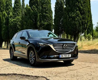 Vooraanzicht van een huurauto Mazda CX-9 in Tbilisi, Georgië ✓ Auto #14663. ✓ Transmissie Automatisch TM ✓ 0 beoordelingen.