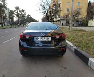 Mazda 3 2015 beschikbaar voor verhuur in Tbilisi, met een kilometerlimiet van onbeperkt.