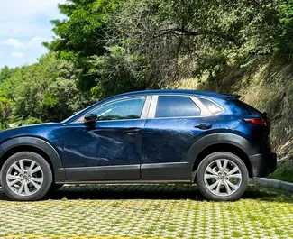 Mazda CX-30 2023 beschikbaar voor verhuur in Tbilisi, met een kilometerlimiet van onbeperkt.