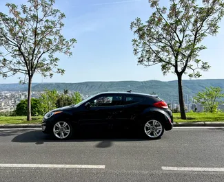 Vooraanzicht van een huurauto Hyundai Veloster in Tbilisi, Georgië ✓ Auto #14604. ✓ Transmissie Automatisch TM ✓ 0 beoordelingen.