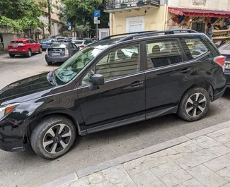 Vooraanzicht van een huurauto Subaru Forester in Tbilisi, Georgië ✓ Auto #13936. ✓ Transmissie Automatisch TM ✓ 0 beoordelingen.