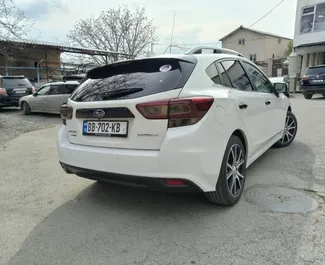 Vooraanzicht van een huurauto Subaru Impreza in Tbilisi, Georgië ✓ Auto #15206. ✓ Transmissie Automatisch TM ✓ 0 beoordelingen.