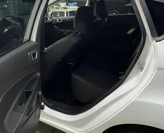 Vooraanzicht van een huurauto Ford Fiesta op de luchthaven van Tirana, Albanië ✓ Auto #15265. ✓ Transmissie Automatisch TM ✓ 0 beoordelingen.