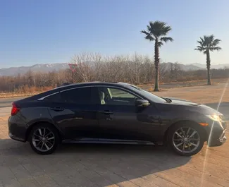 Vooraanzicht van een huurauto Honda Civic in Batumi, Georgië ✓ Auto #15519. ✓ Transmissie Automatisch TM ✓ 0 beoordelingen.