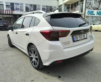 Vooraanzicht van een huurauto Subaru Impreza in Tbilisi, Georgië ✓ Auto #15458. ✓ Transmissie Automatisch TM ✓ 0 beoordelingen.