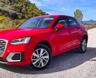 Vooraanzicht van een huurauto Audi Q2 op Podgorica Luchthaven, Montenegro ✓ Auto #15662. ✓ Transmissie Automatisch TM ✓ 0 beoordelingen.
