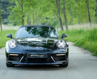 Vooraanzicht van een huurauto Porsche 911 Carrera Cabrio in Becici, Montenegro ✓ Auto #15908. ✓ Transmissie Automatisch TM ✓ 0 beoordelingen.