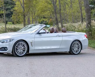 Vooraanzicht van een huurauto BMW 428i Cabrio in Becici, Montenegro ✓ Auto #2476. ✓ Transmissie Automatisch TM ✓ 0 beoordelingen.