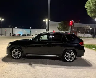 Autohuur BMW X1 2013 in in Albanië, met Diesel brandstof en  pk ➤ Vanaf 35 EUR per dag.