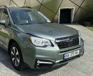 Vooraanzicht van een huurauto Subaru Forester in Tbilisi, Georgië ✓ Auto #15694. ✓ Transmissie Automatisch TM ✓ 0 beoordelingen.