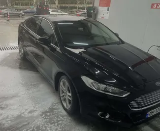 Vooraanzicht van een huurauto Ford Mondeo in Tbilisi, Georgië ✓ Auto #15789. ✓ Transmissie Automatisch TM ✓ 0 beoordelingen.