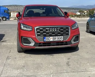 Vooraanzicht van een huurauto Audi Q2 op Podgorica Luchthaven, Montenegro ✓ Auto #15662. ✓ Transmissie Automatisch TM ✓ 0 beoordelingen.