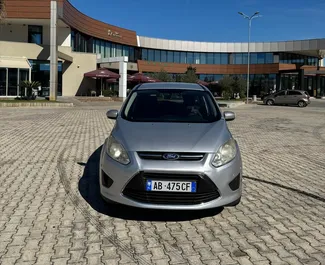 Vooraanzicht van een huurauto Ford C-Max Grand in Tirana, Albanië ✓ Auto #16440. ✓ Transmissie Handmatig TM ✓ 0 beoordelingen.