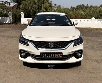 Vooraanzicht van een huurauto Suzuki Baleno op de luchthaven van Goa, Goa ✓ Auto #16160. ✓ Transmissie Automatisch TM ✓ 0 beoordelingen.