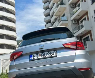Vooraanzicht van een huurauto SEAT Arona op Podgorica Luchthaven, Montenegro ✓ Auto #16088. ✓ Transmissie Automatisch TM ✓ 0 beoordelingen.