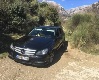 Vooraanzicht van een huurauto Mercedes-Benz C-Class op Podgorica Luchthaven, Montenegro ✓ Auto #16214. ✓ Transmissie Automatisch TM ✓ 0 beoordelingen.