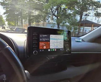 Interieur van Toyota Yaris te huur in Georgië. Een geweldige auto met 5 zitplaatsen en een Automatisch transmissie.