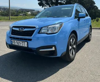 Vooraanzicht van een huurauto Subaru Forester in Tbilisi, Georgië ✓ Auto #16571. ✓ Transmissie Automatisch TM ✓ 0 beoordelingen.