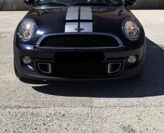 Vooraanzicht van een huurauto Mini Cooper S Cabrio in Budva, Montenegro ✓ Auto #16573. ✓ Transmissie Handmatig TM ✓ 0 beoordelingen.